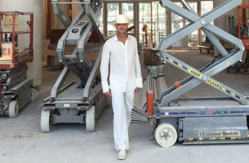 Alan Faena in all white at a construction site