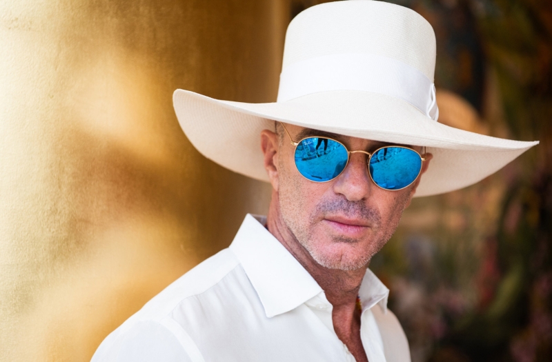 alan faena in sunglasses and a white hat