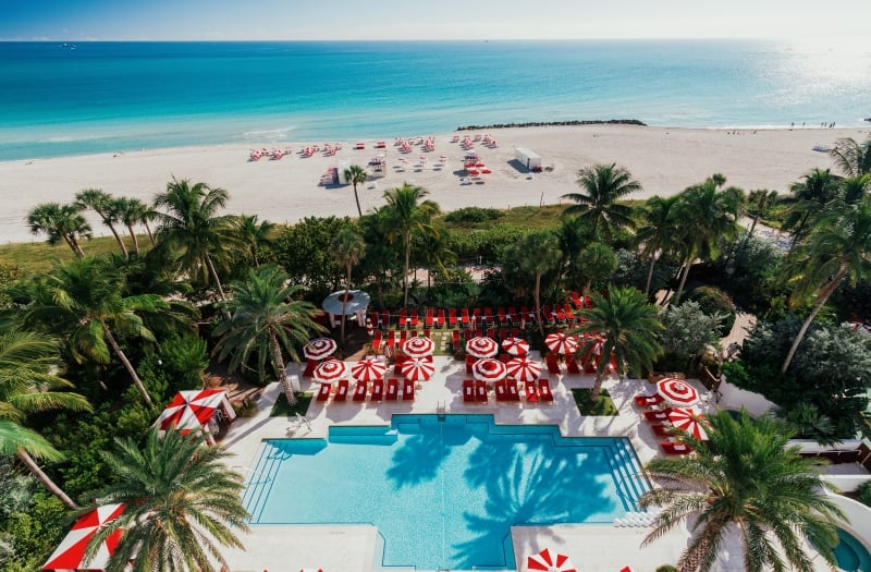 Aerial view of hotel pool on the edge of beach