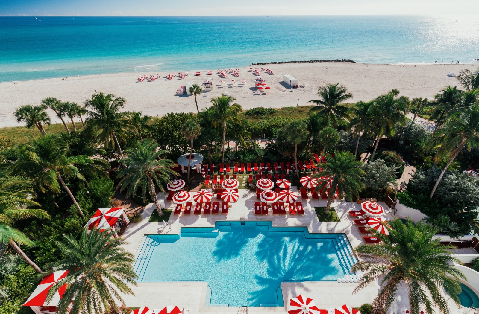 Aerial view of hotel pool on the edge of beach