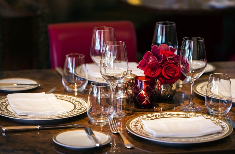 table setting with rose centerpieces