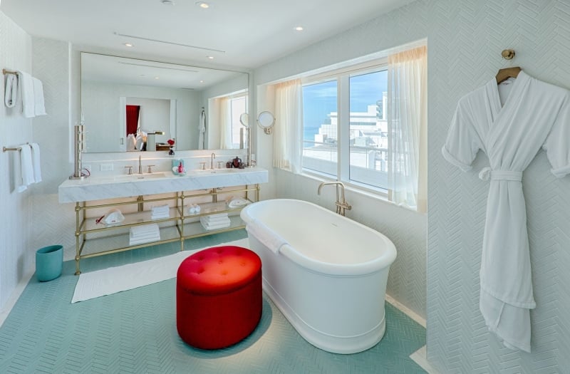 hotel bathroom with large stand alone bathtub
