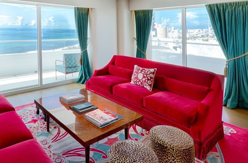 living room in imperial suite with red couch