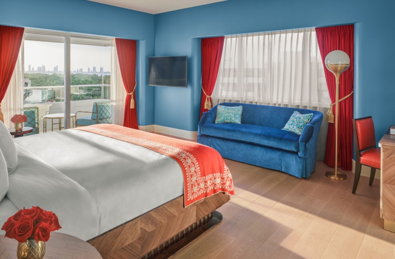 hotel imperial suite bedroom with bed and couch
