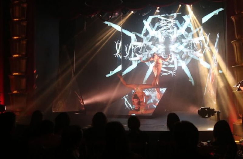 samsara cabaret performers create geometric pattern with their legs and arms