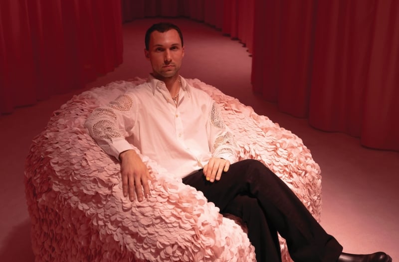 Andrés Reisinger sitting in a fluffy chair