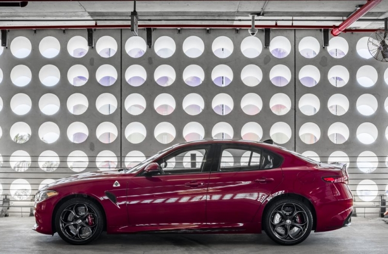 Red alfa romeo car in garage