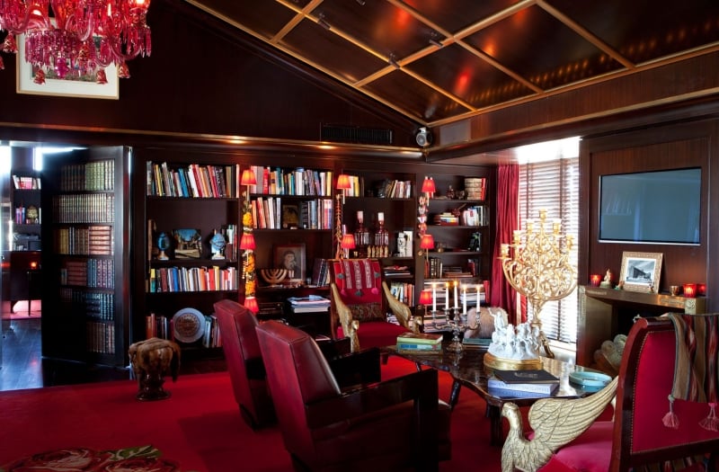 Sitting area in Faena Suite with large library on wall