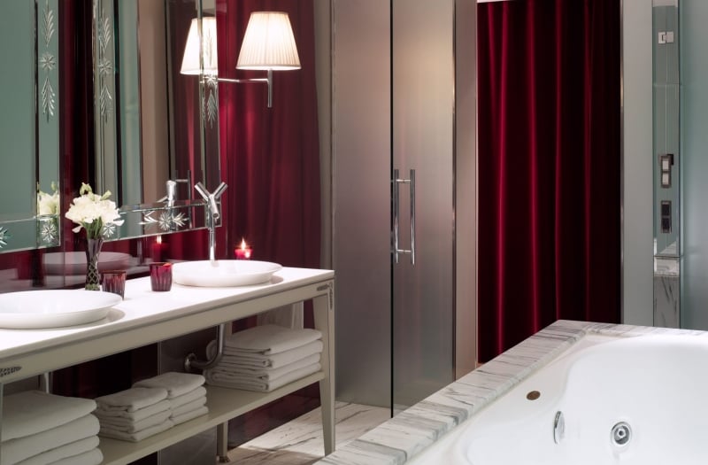 bathroom with double sink vanity and bathtub