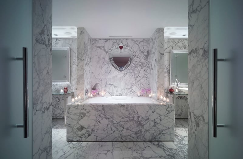 large marble bathtub in hotel suite