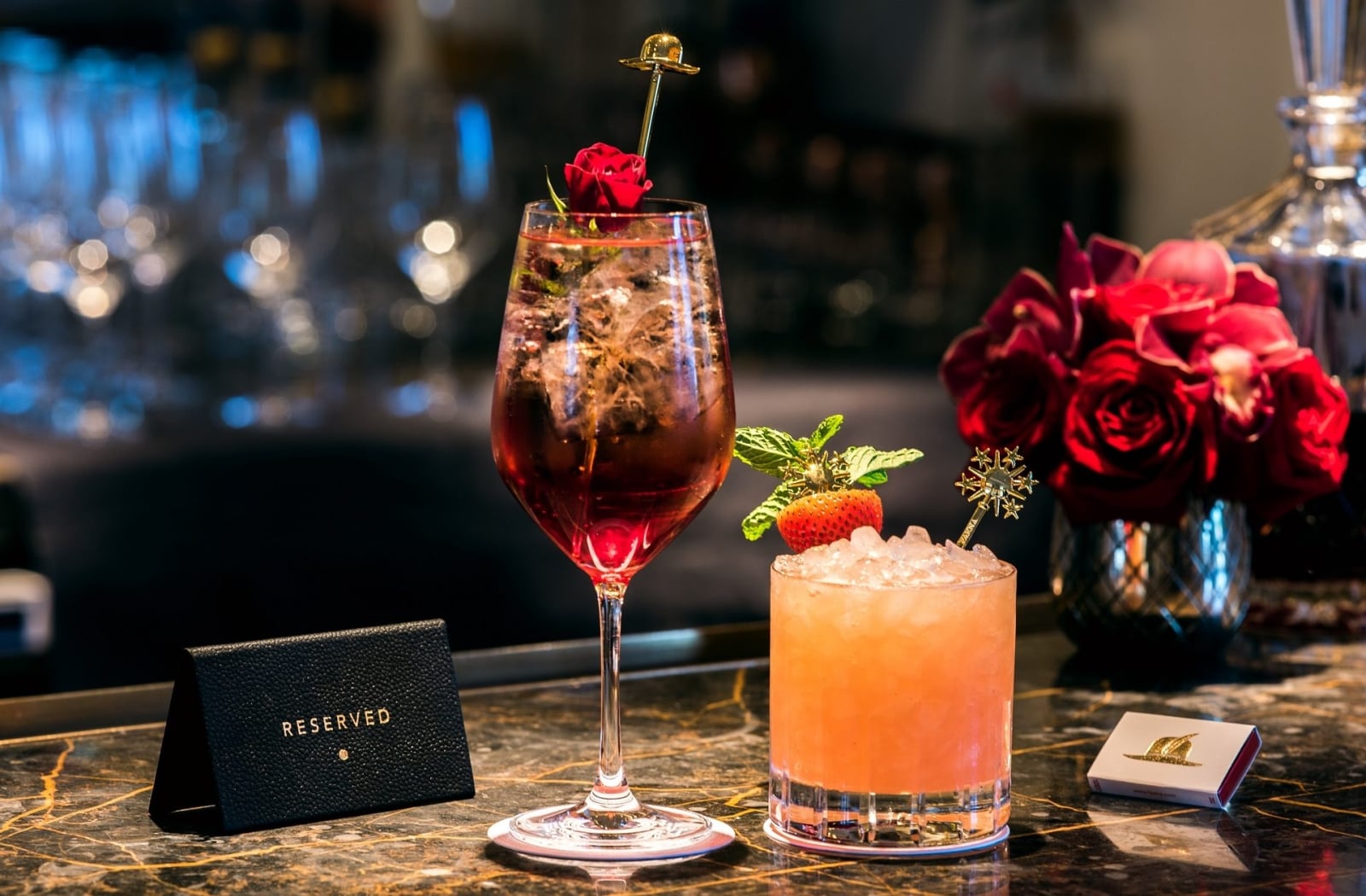 two cocktails on a bar