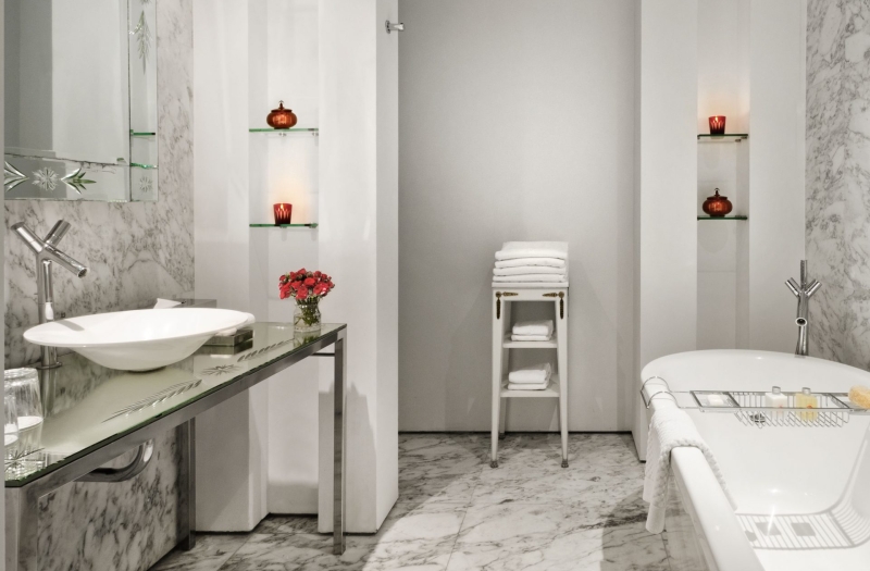 hotel bathroom with large stand alone bathtub