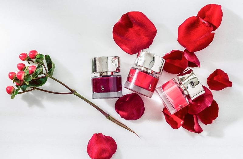 rose petals and small glass bottles
