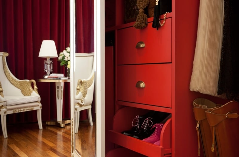 hotel closet dress with large mirror and chair