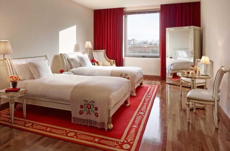 two hotel beds with white linens