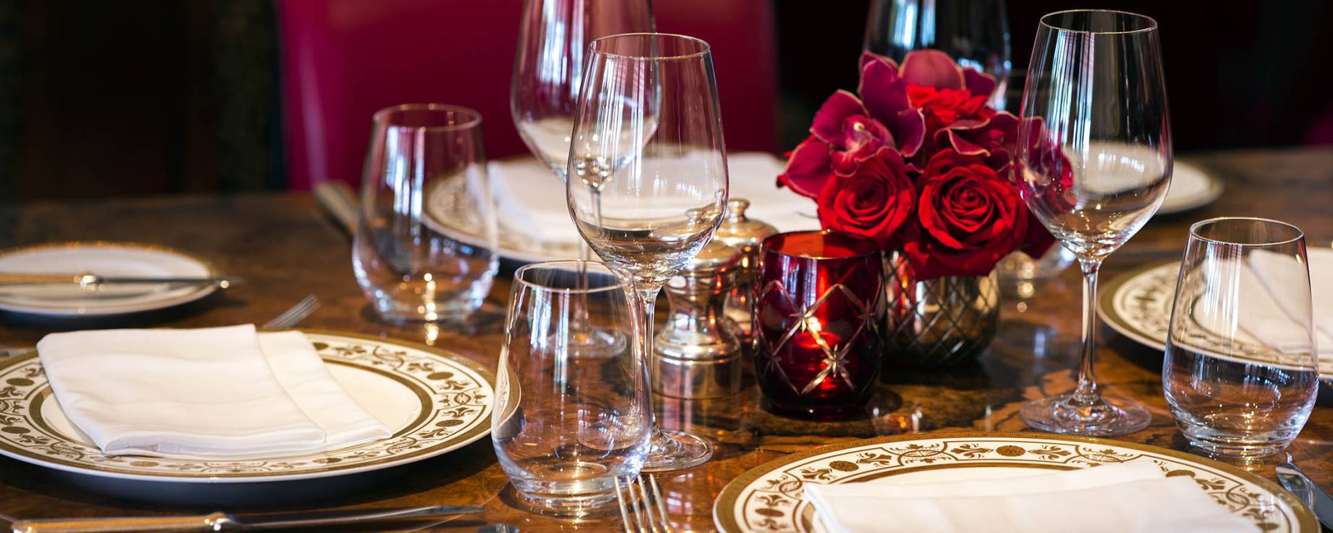table setting with rose centerpieces
