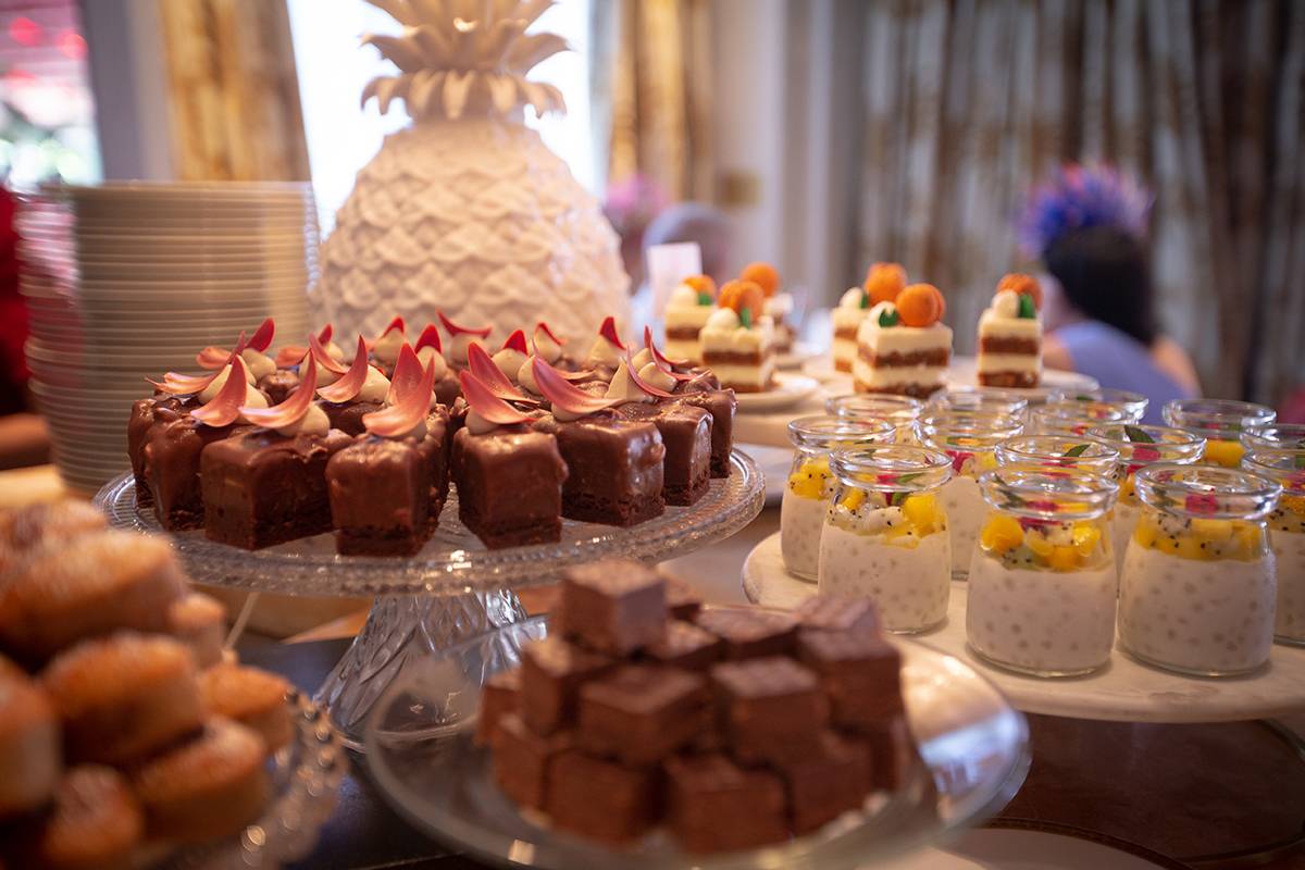 buffet of desserts with ceramic pineapple display
