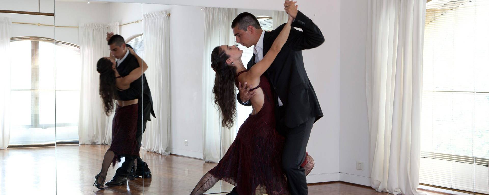 two couples dance the tango