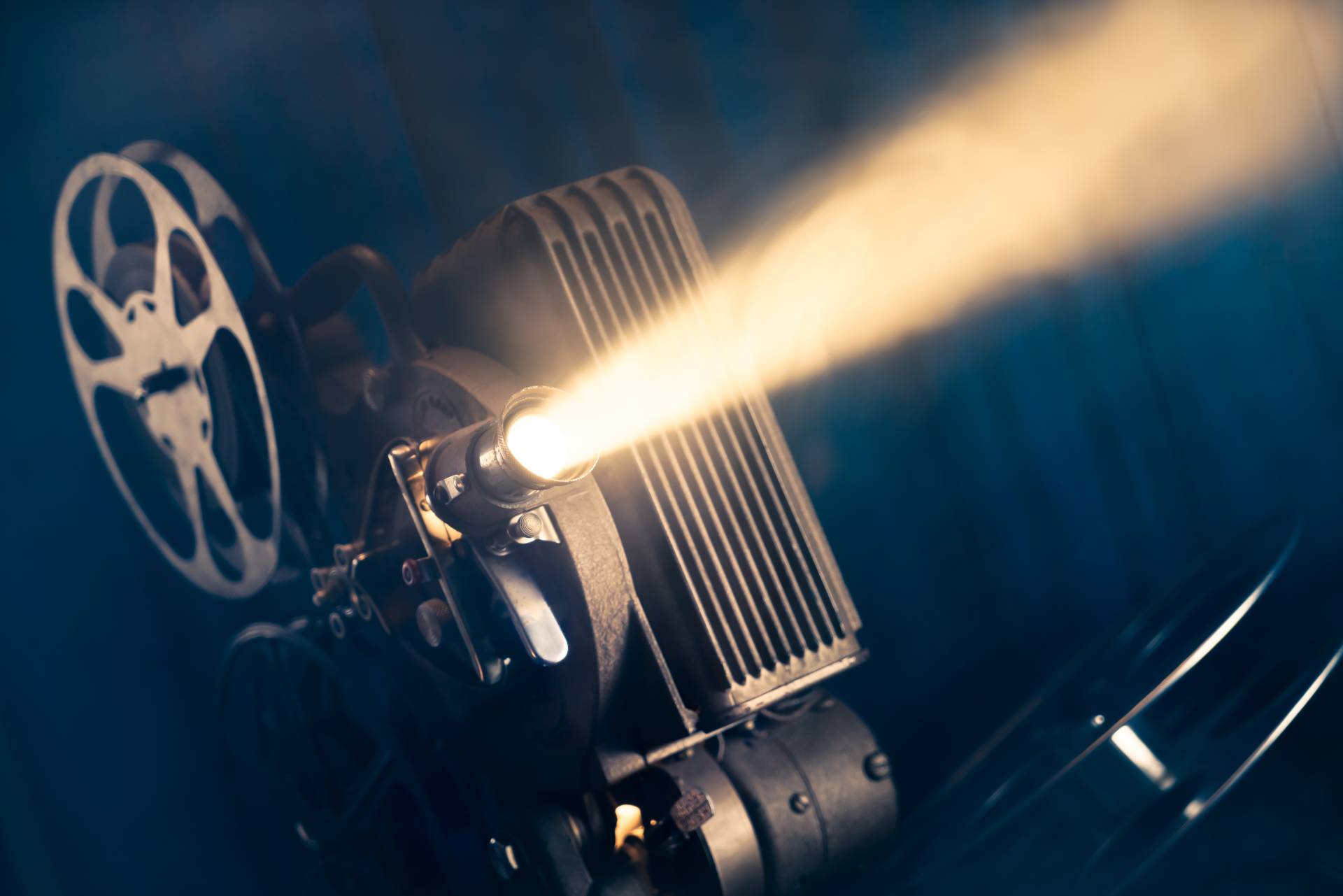 traditional movie projector with light coming from lens