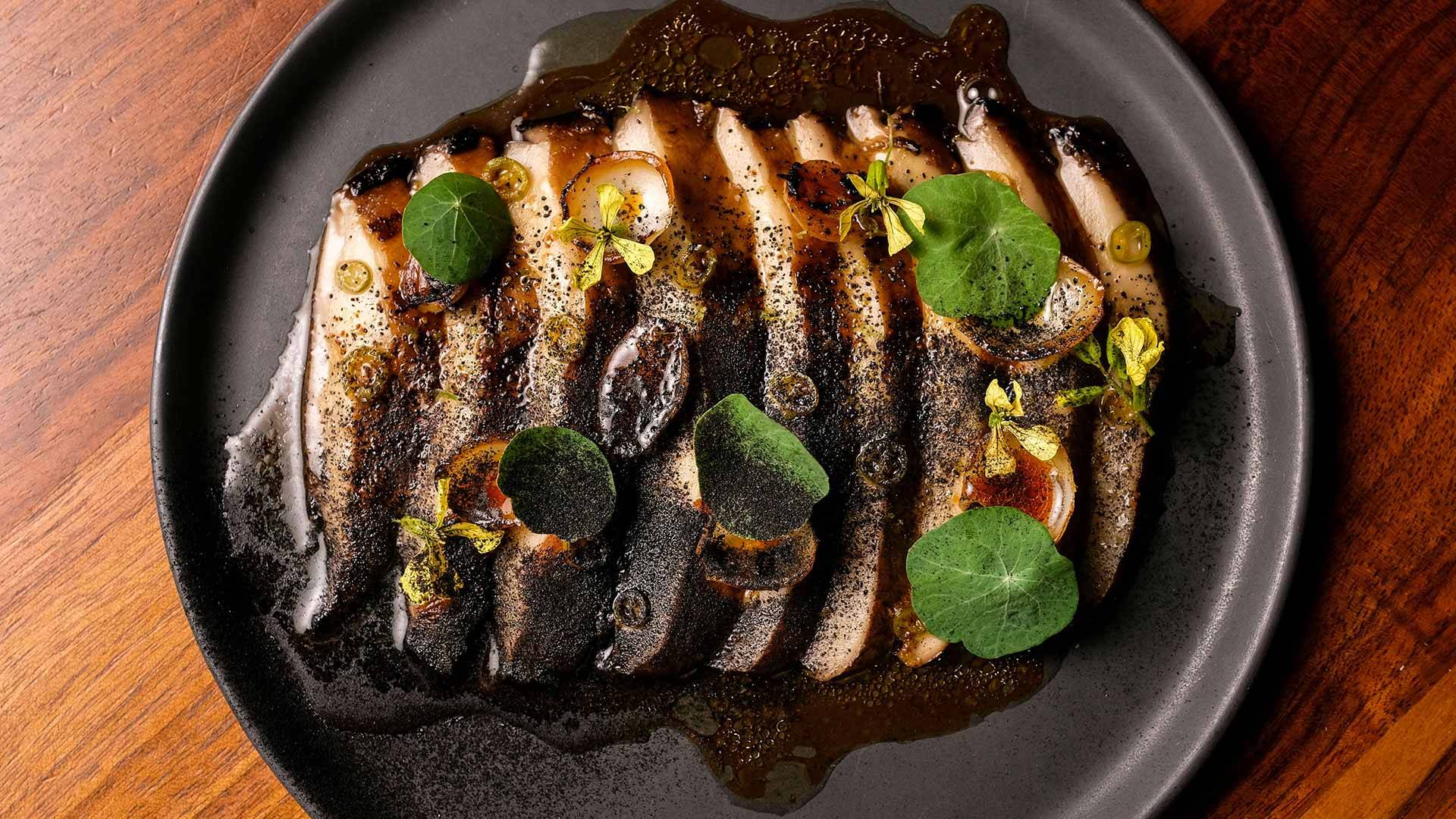 top down of a plate of food with sauce and greens