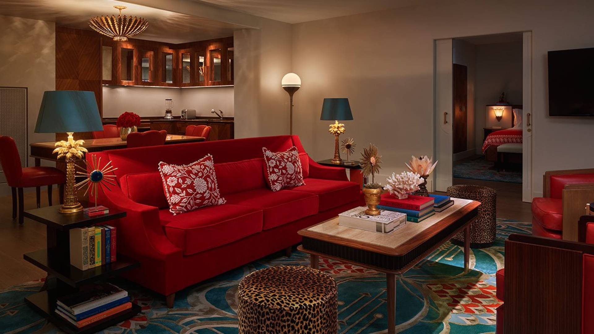red couch seating area of hotel suite