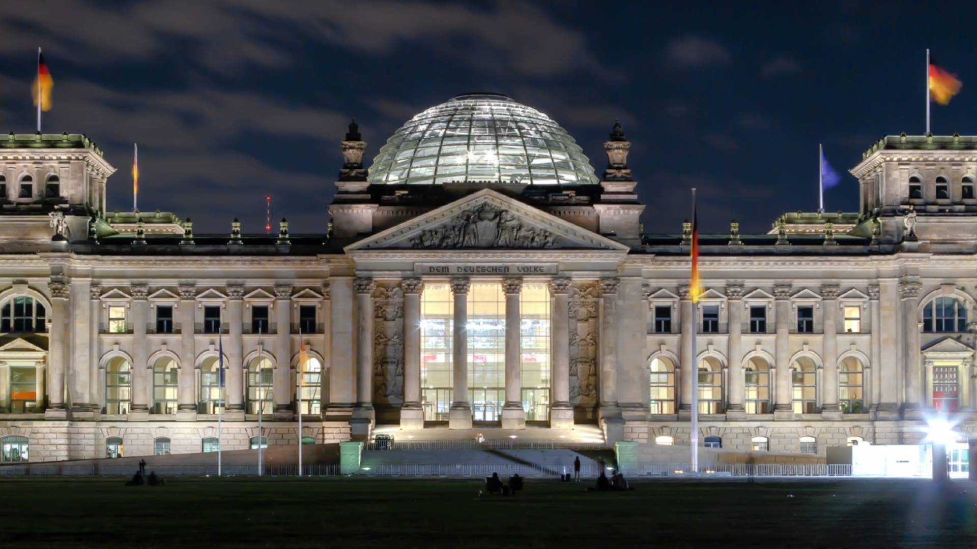 The German Reichstag building at night in modern day