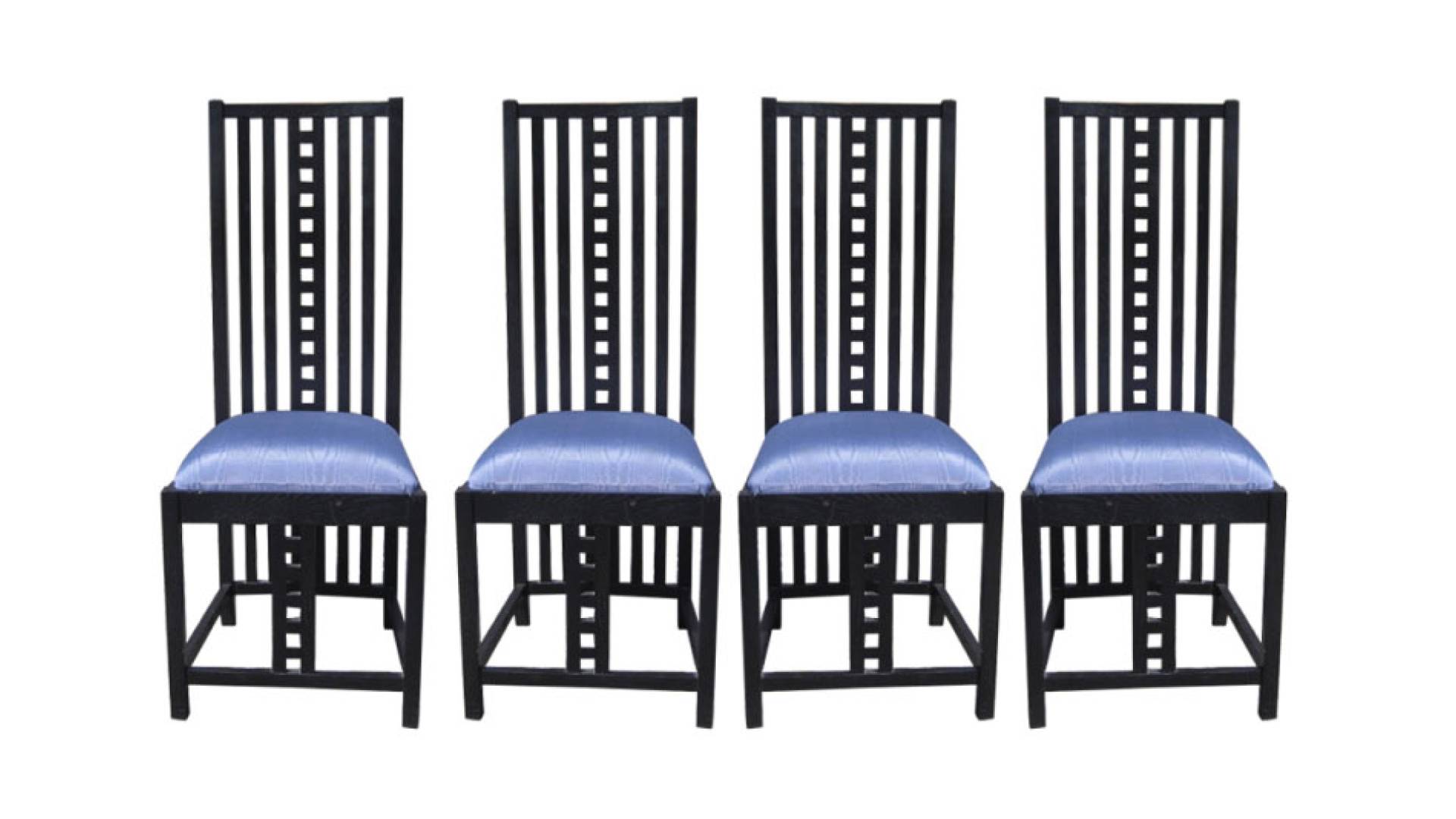 Wooden dining chairs with blue seat cushions made by Charles Mackintosh