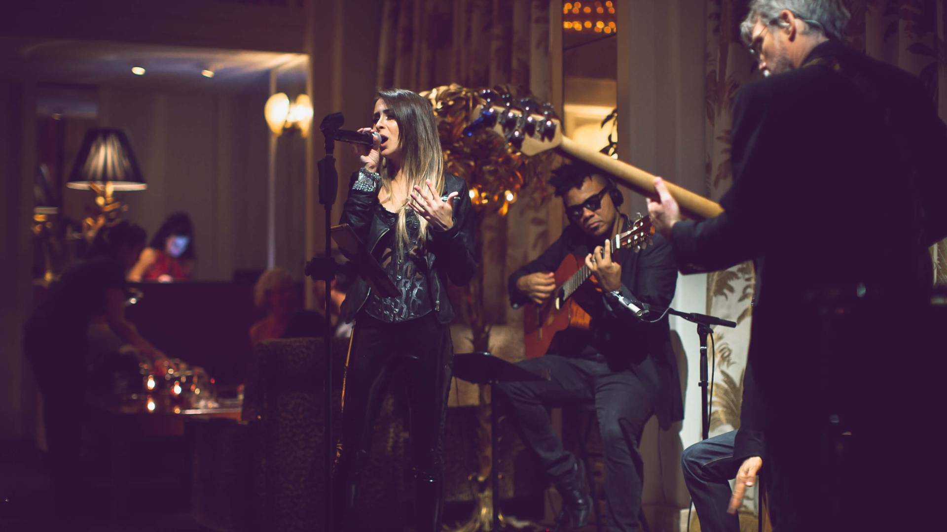 woman singing with a band