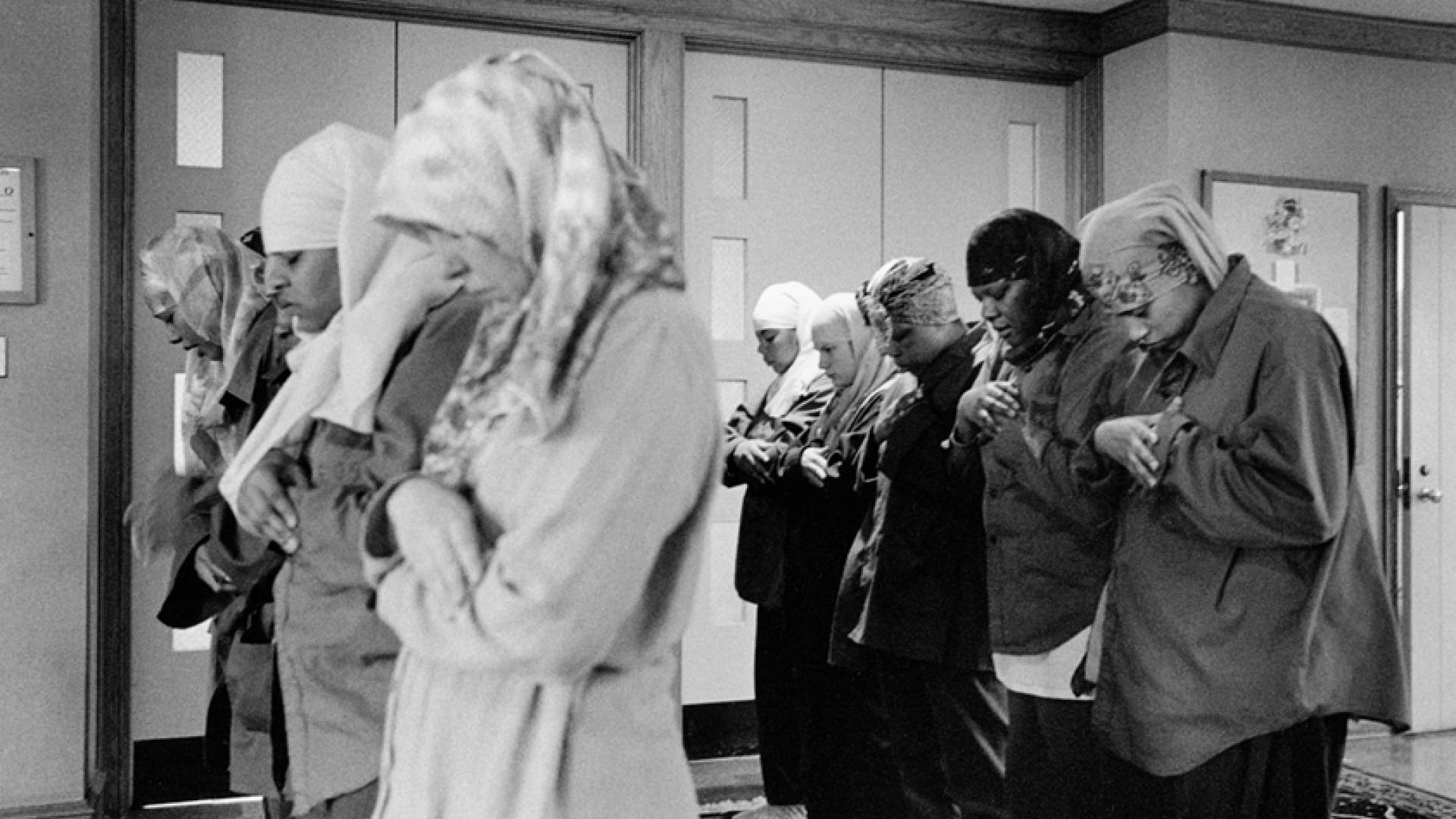 Women praying in prison