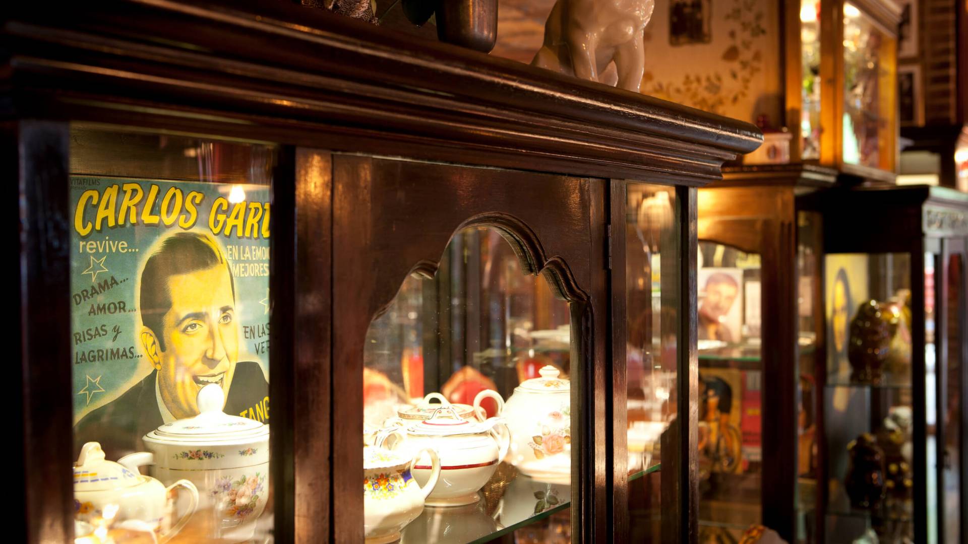 interior shot of cabinet with shelves full of ornate dishware