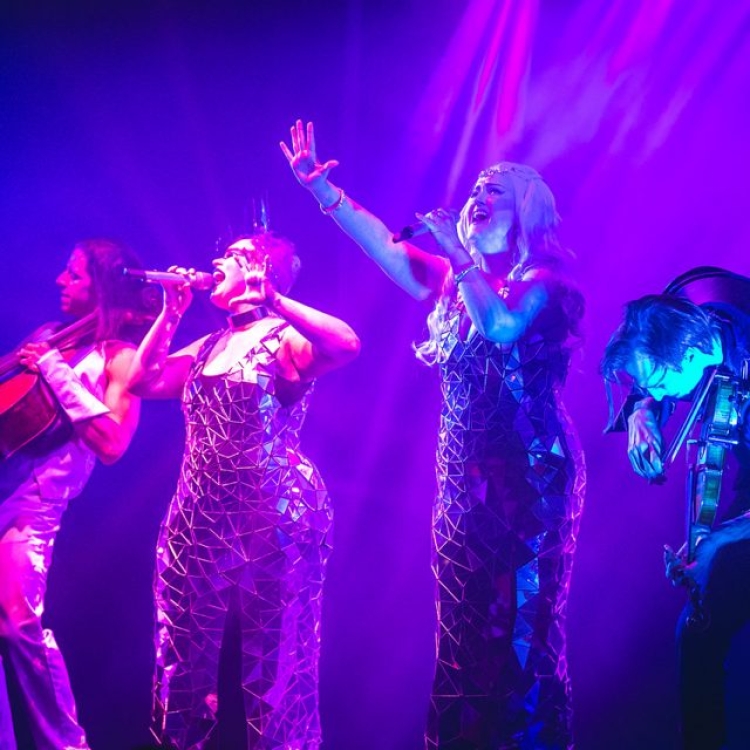 Samsara performers singing on stage