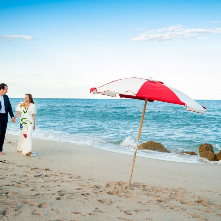 Couple walk along the beach