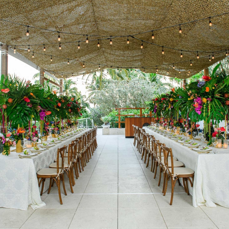 Dining area under burlap canopy