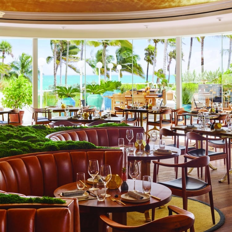 pao dining area with windows to the ocean