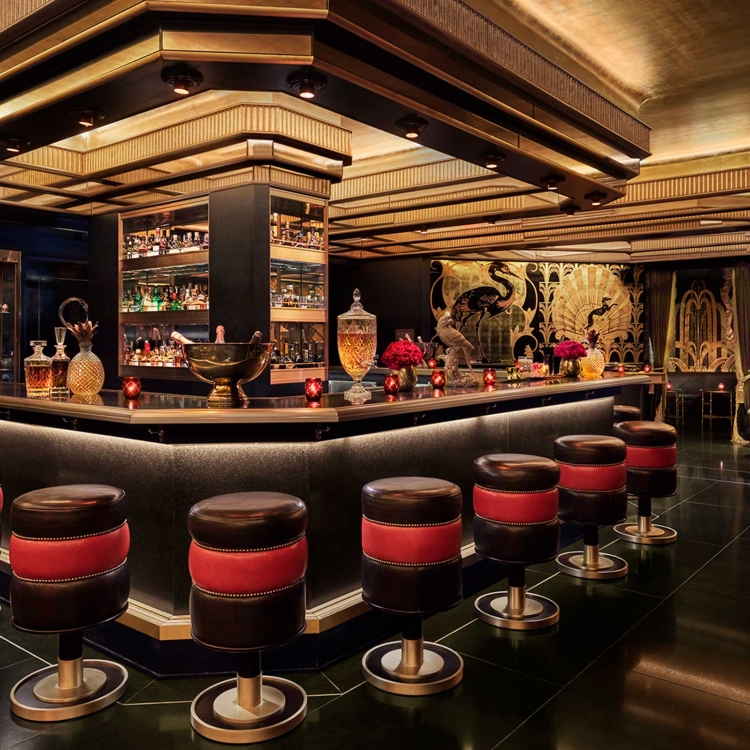 saxony bar interior with red and black stools at the bar