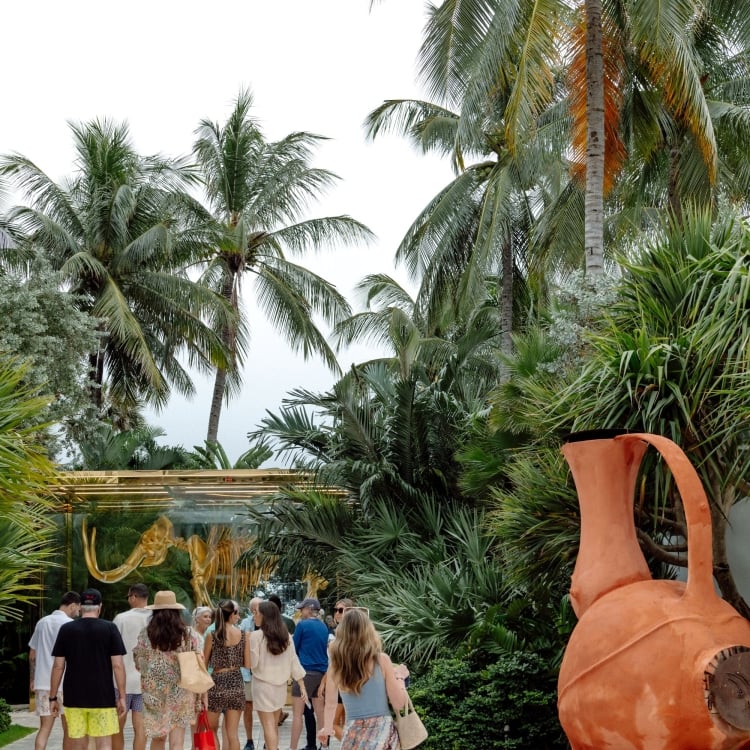 Wedding guests walking to the beach