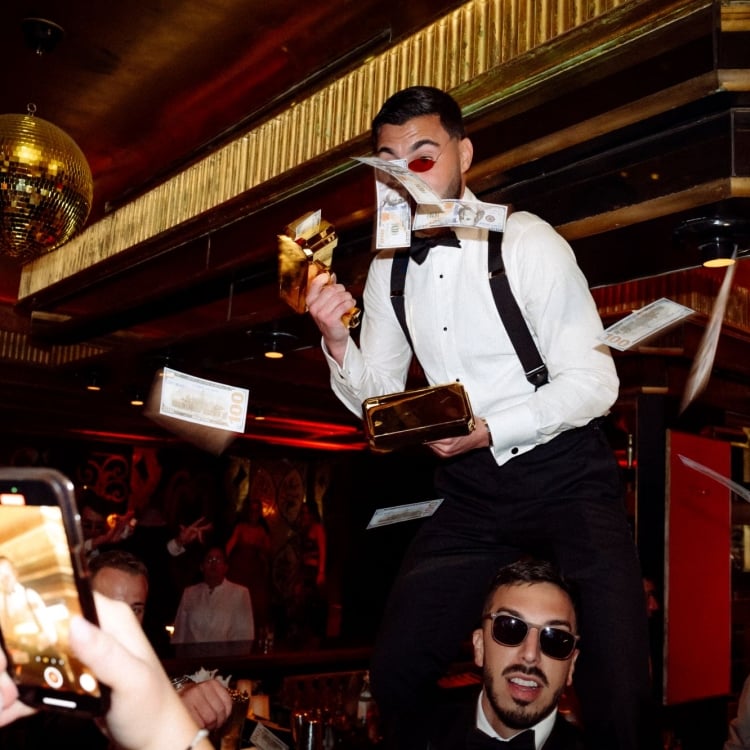 a groom with a gold money gun
