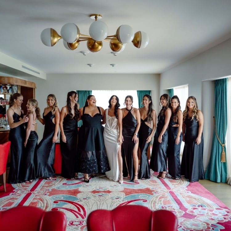 bridal party posing in a living room