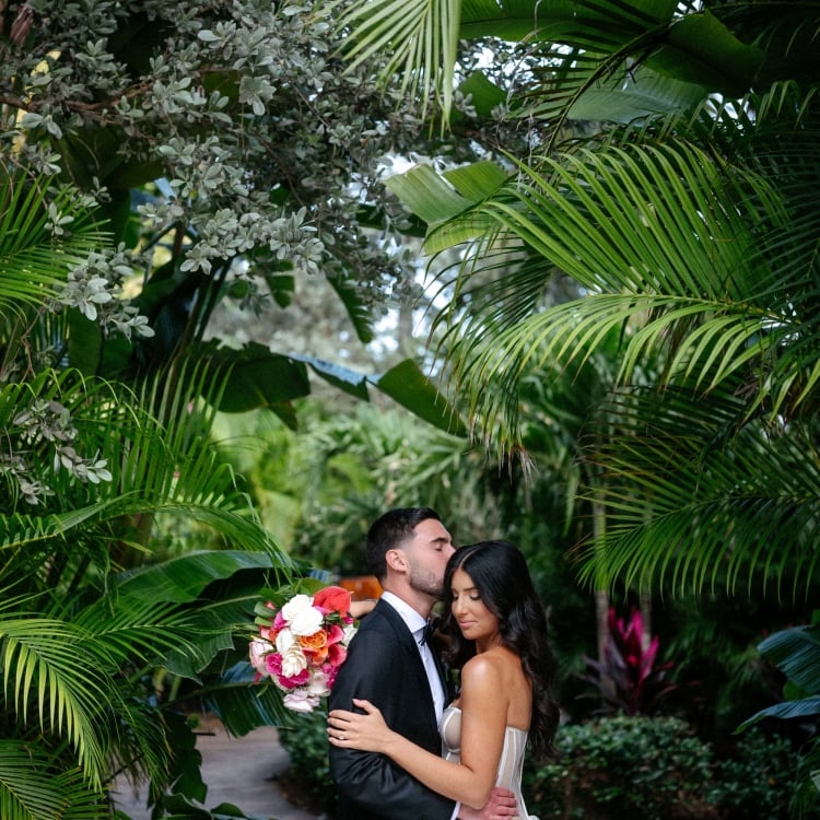 A bride and groom cuddling