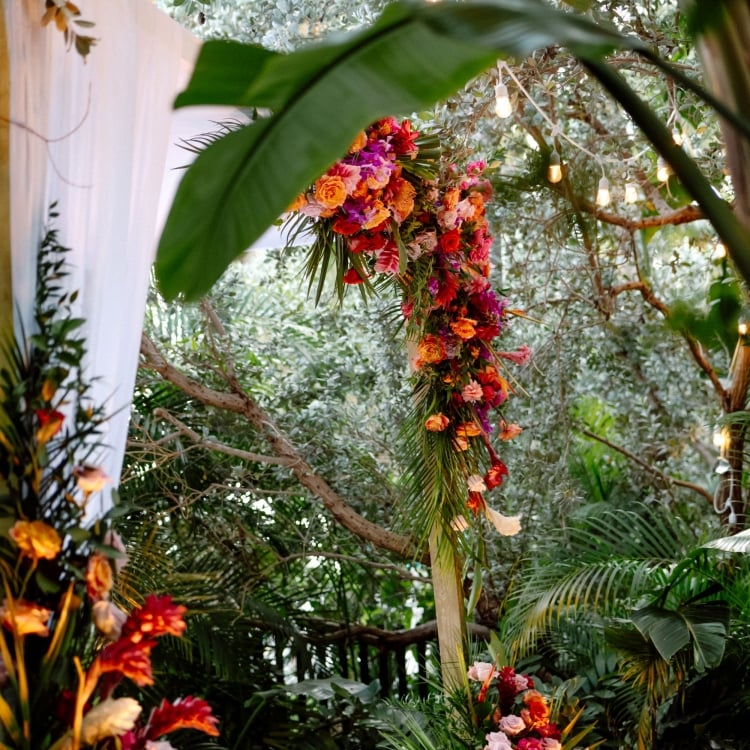 outdoor wedding alter with bright flowers