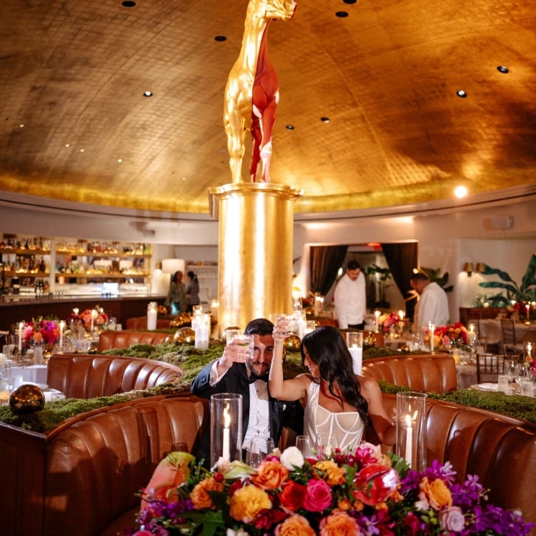 Bride and groom toasting at Pao