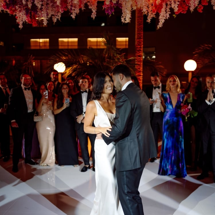 A bride and groom dancing