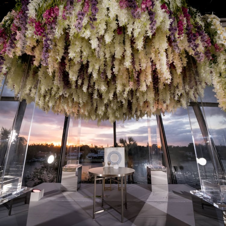 close up of floral wedding arch in Faena Forum