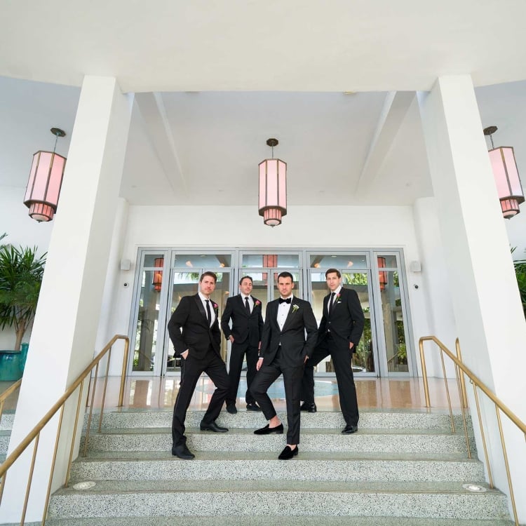 Groomsman standing on staircase