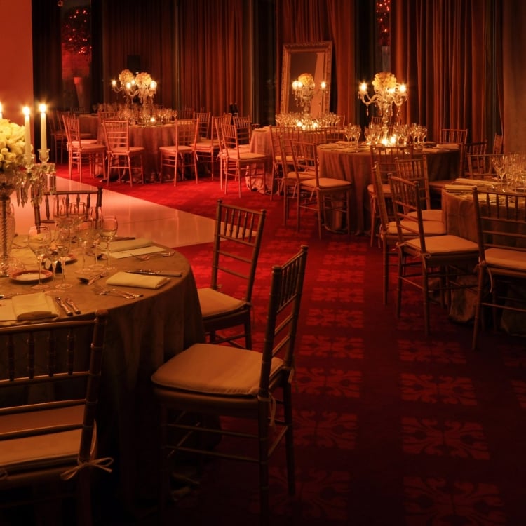 Interior view of the ballroom with reception tables and candle light