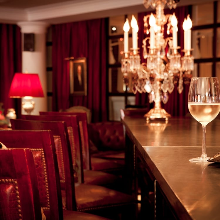 library lounge seats at the bar with wine glass and candlestick