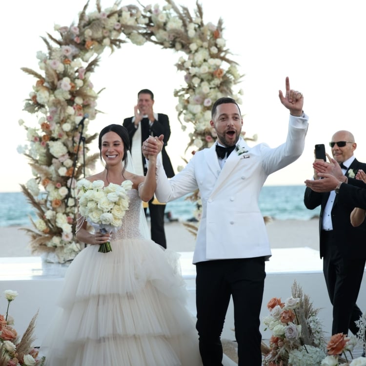 Angie & Luigi walking down the aisle after getting married