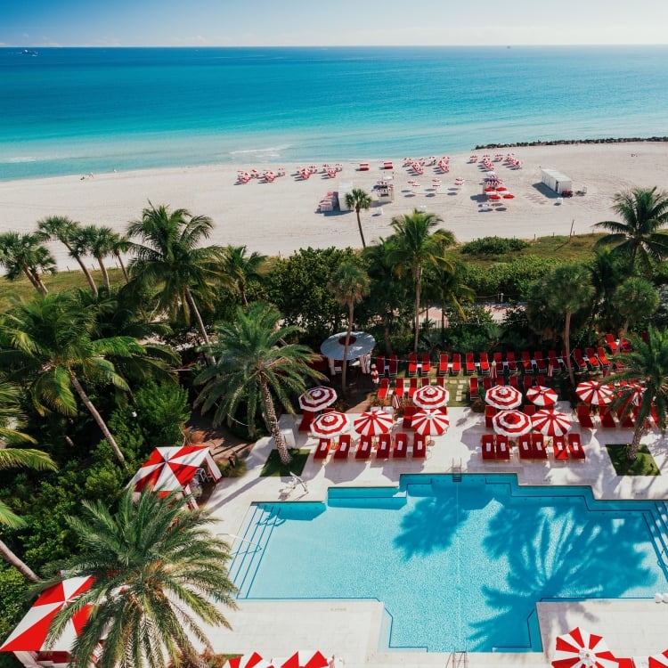 Aerial view of hotel pool on the edge of beach