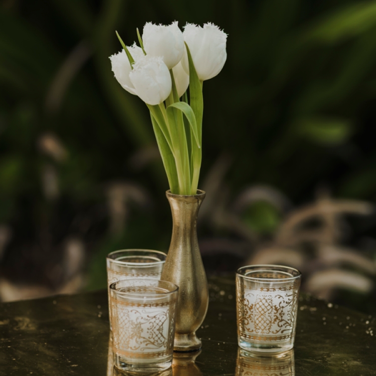 Side table with small floral arrangement and candles