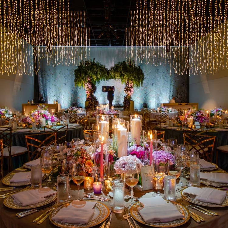 interior view of table setting and overhead lighting at wedding venue